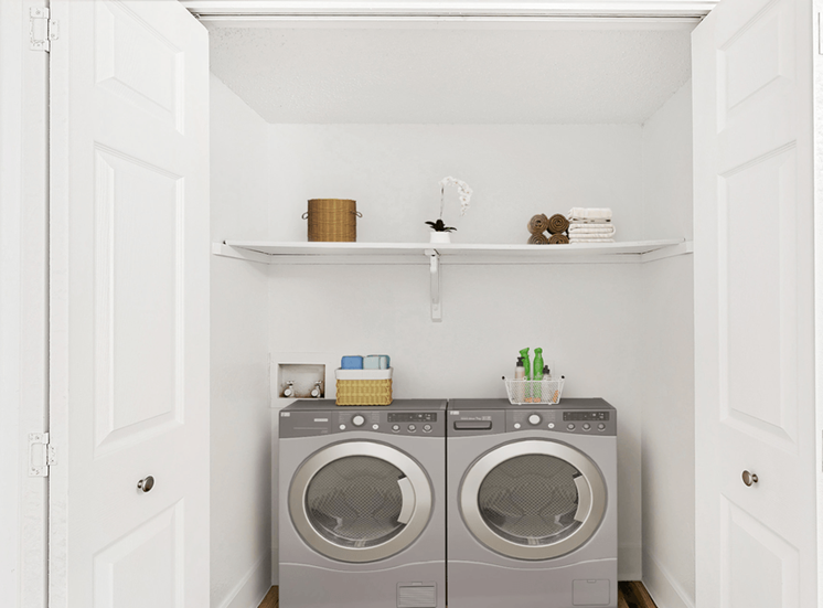 Virtually staged laundry room with stainless washer and dryer, shelf with towels and neatly organized items in baskets
